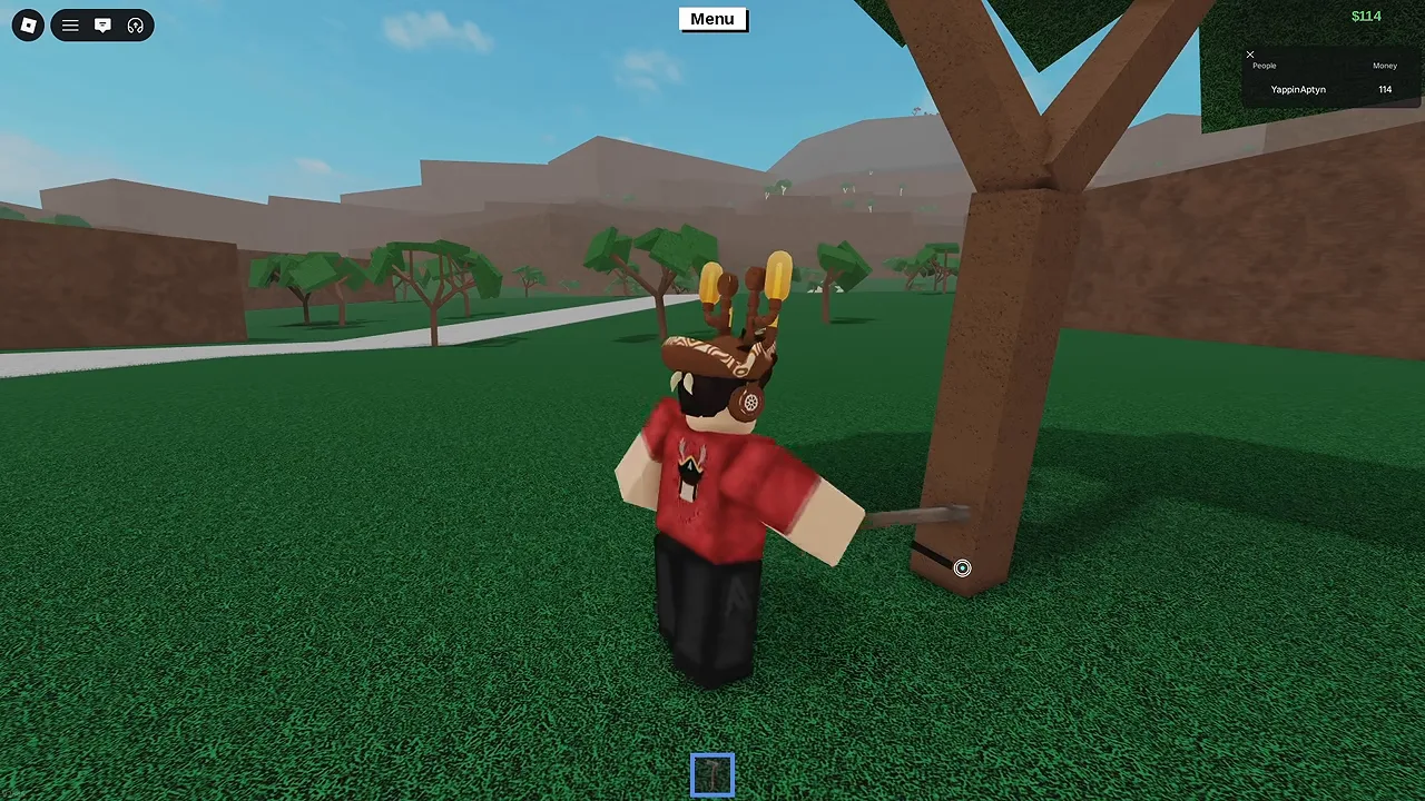 A player in a red shirt swinging an axe into the trunk of a tree on open grass