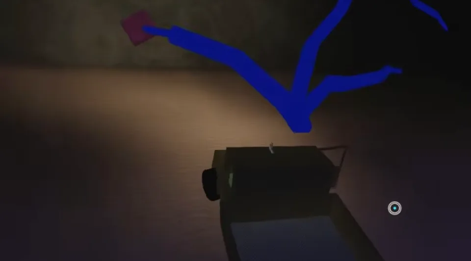 A dark truck below a branching blue tree with purple leaves inside a cave